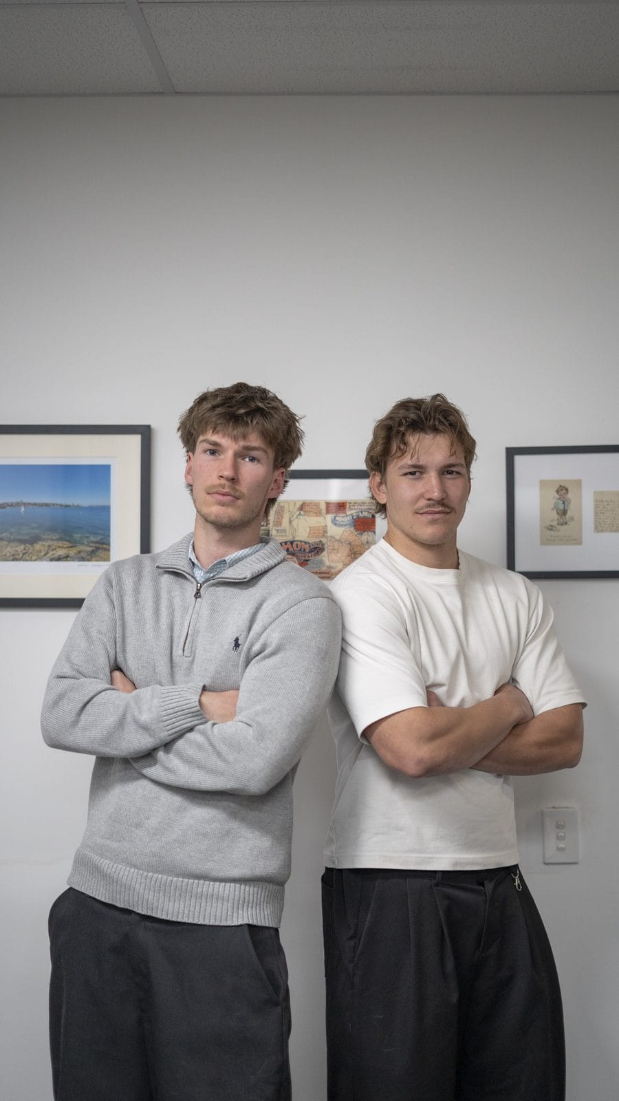 Noah Shaw and Jacob Harder, the two Ostley partners, standing back to back